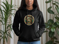 Black hoodie with a circular emblem featuring a horseshoe, dice, and the text 