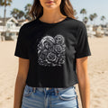 Black t-shirt featuring a skull, roses, and celestial imagery.