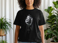 T-shirt with black and white graphic of a hand holding rosary beads.