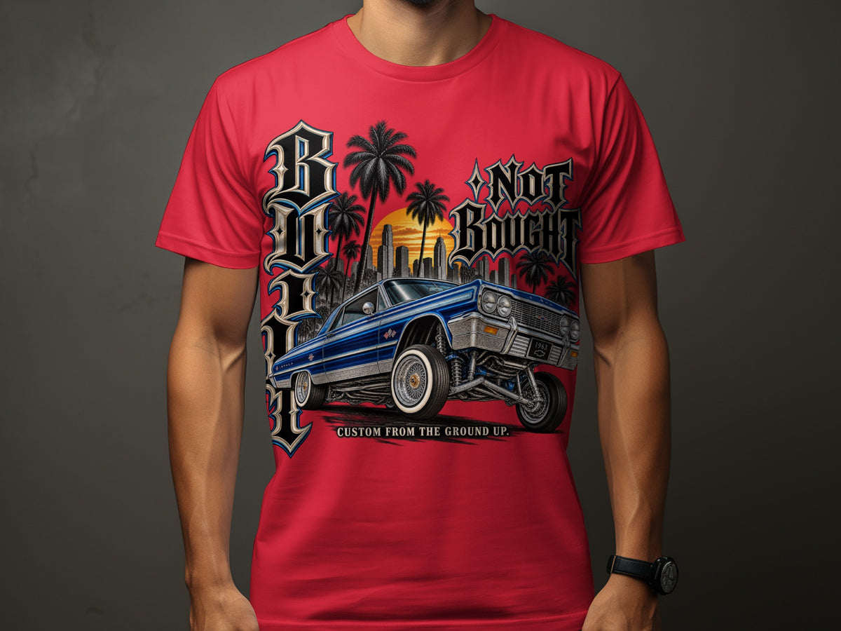 Red t-shirt with graphic of blue 1963 Chevrolet Impala lowrider at sunset.