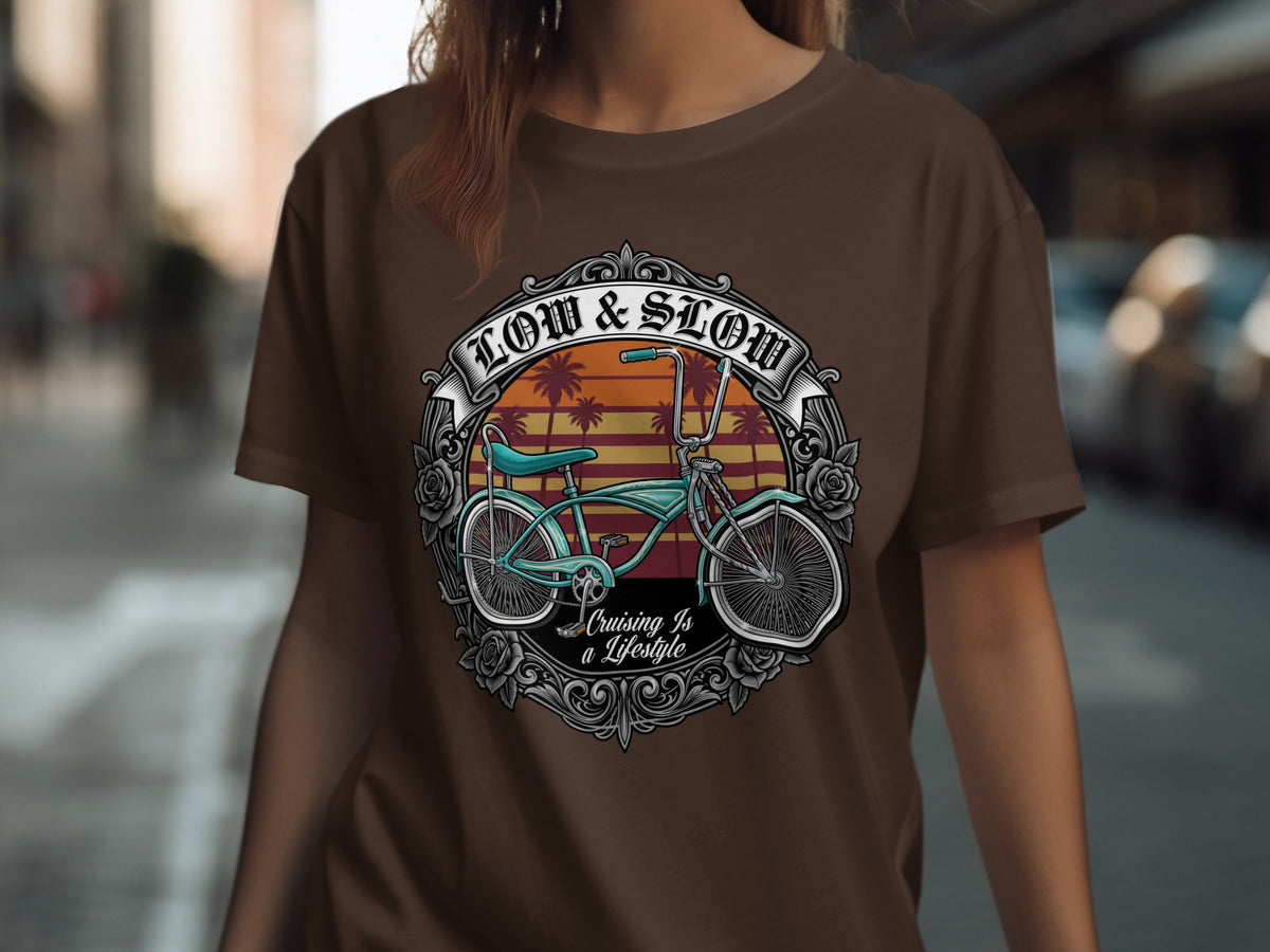 Brown t-shirt with "Low & Slow Cruising Is a Lifestyle" text and a vintage bicycle graphic.