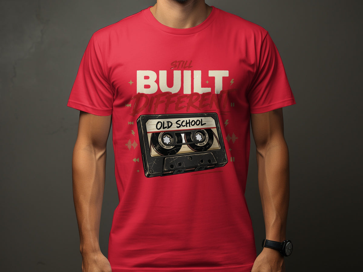 Red t-shirt with "STILL BUILT DIFFERENT OLD SCHOOL" and cassette tape graphic.
