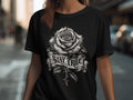 Black t-shirt with a detailed grayscale rose and banner reading 