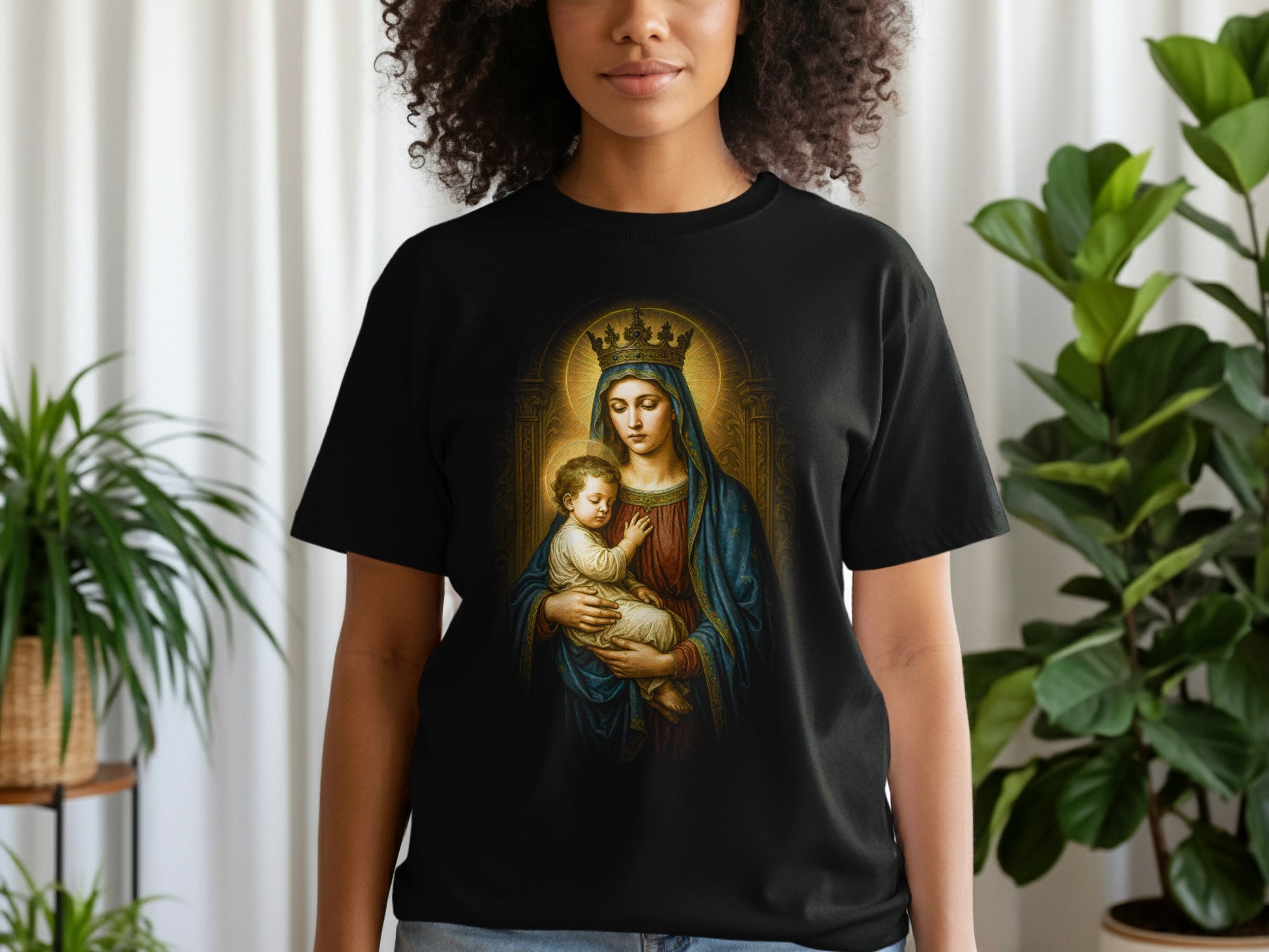 T-shirt featuring religious artwork of the Virgin Mary holding the infant Jesus.