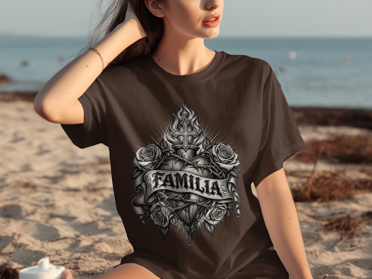 Brown t-shirt with a detailed graphic of a heart, cross, roses, and the word "FAMILIA".