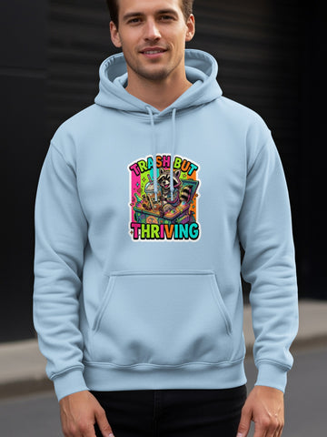 Light blue hoodie with "Trash But Thriving" raccoon graphic.