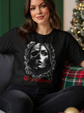 Woman wearing a black t-shirt with a skull and rose graphic and the word 