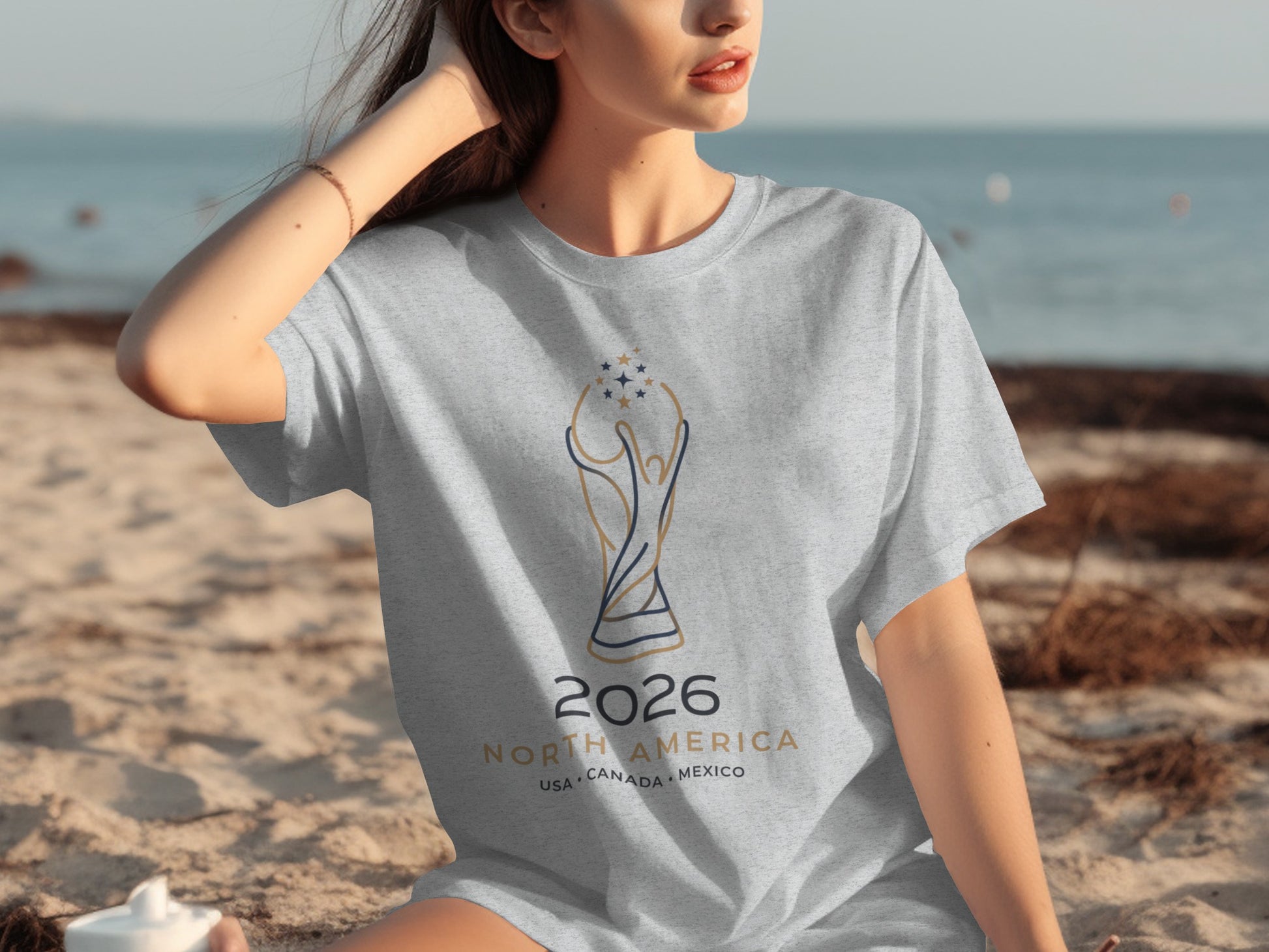 Gray t-shirt with 2026 North America trophy design, USA Canada Mexico.