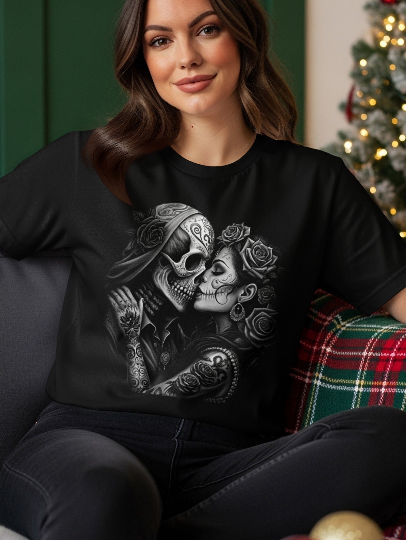 Couple in skull makeup kissing, surrounded by roses and ornamental details.