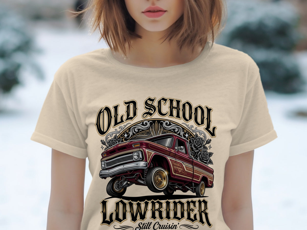 "Old School Lowrider Still Cruisin'" graphic with a red lowrider truck and roses on a tan t-shirt.