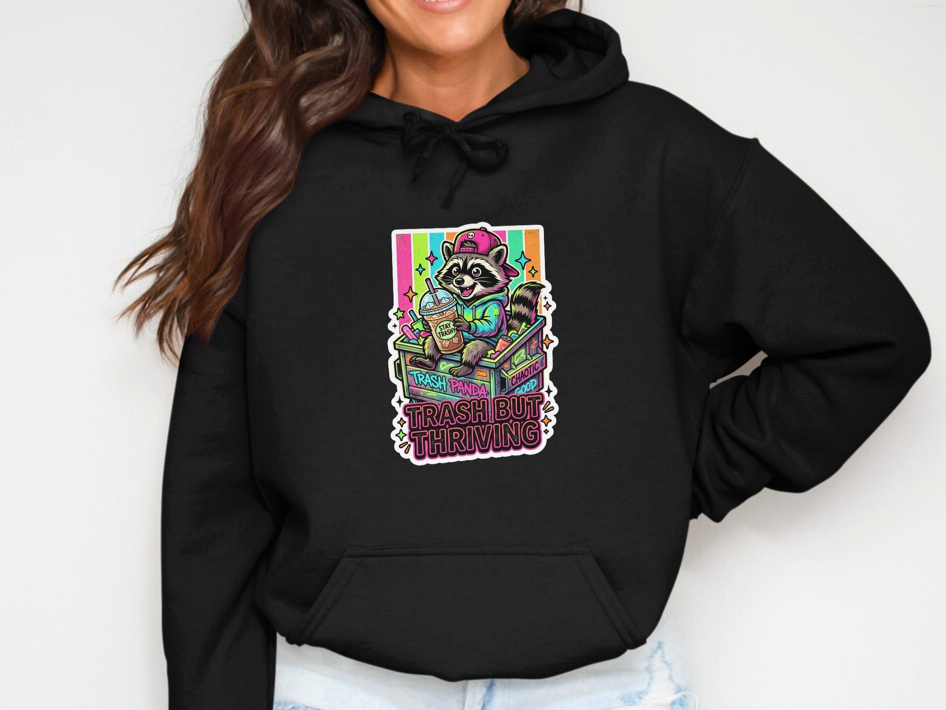 Hoodie with raccoon holding coffee and text "Trash Panda Thriving".
