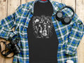 Black t-shirt with brown graphic of women and 