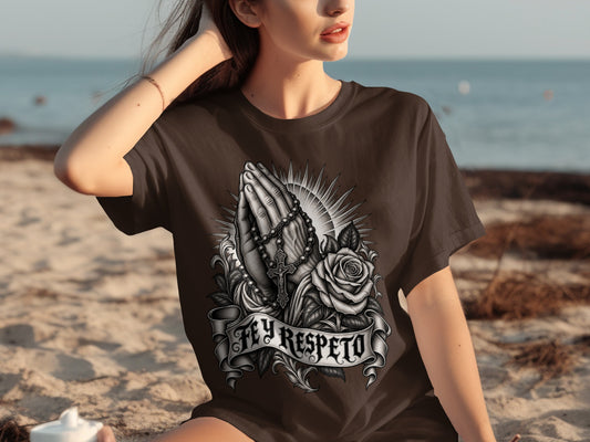 Dark brown t-shirt with praying hands, rosary, rose, and "FEY RESPETO" text.