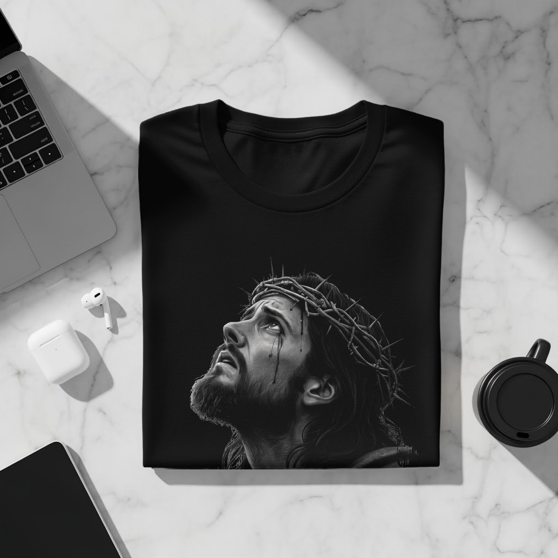 Black t-shirt with a detailed grayscale illustration of Jesus wearing a crown of thorns.