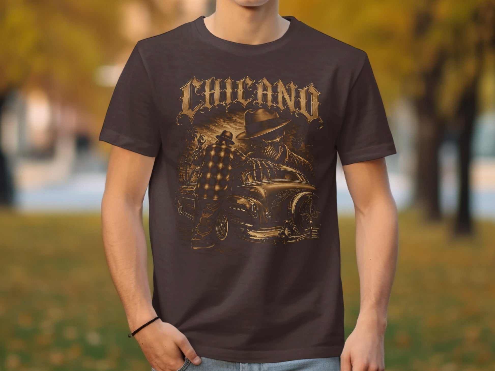 Chicano graphic t-shirt featuring a skeleton in a fedora and a classic car.
