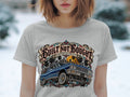 T-shirt graphic with blue 1963 Impala, palm trees, and city skyline.