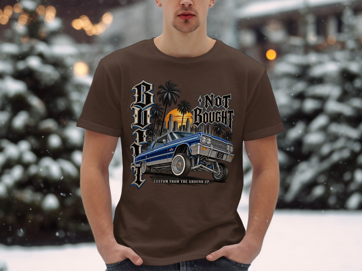Brown t-shirt with blue lowrider and "Built Not Bought" text.