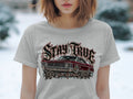 T-shirt with graphic of red classic car, roses, and text 