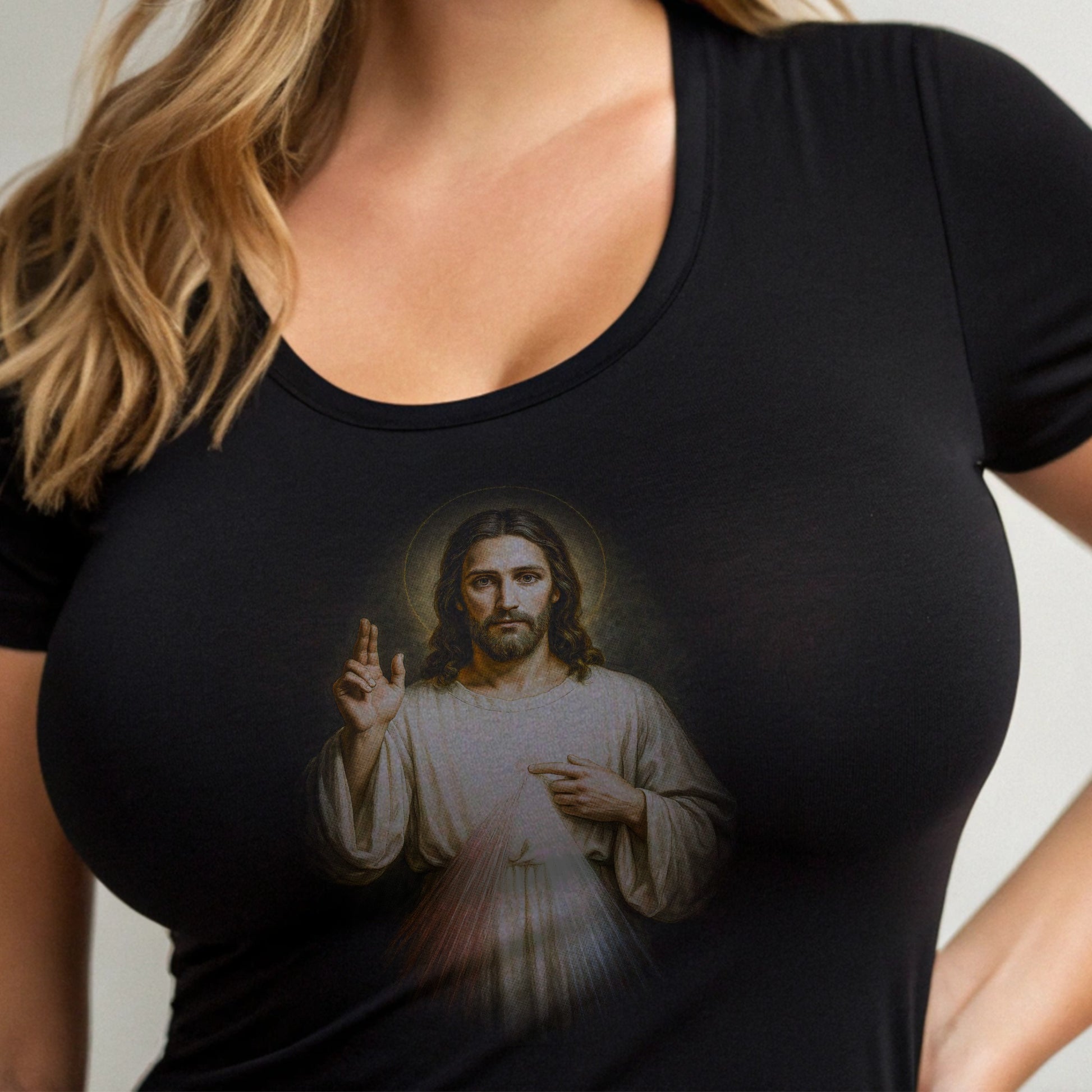 Black t-shirt with a print of Jesus Christ with his hand raised.