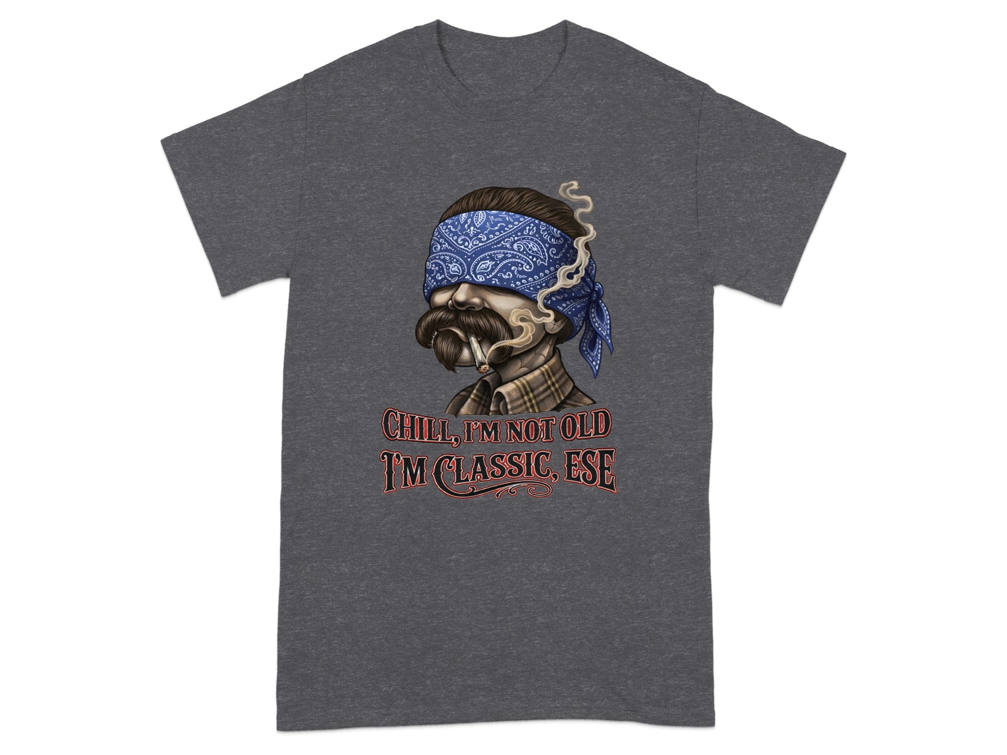Dark t-shirt with graphic of man wearing bandana, smoking, with text "Chill, I'm not old I'm classic, Ese".
