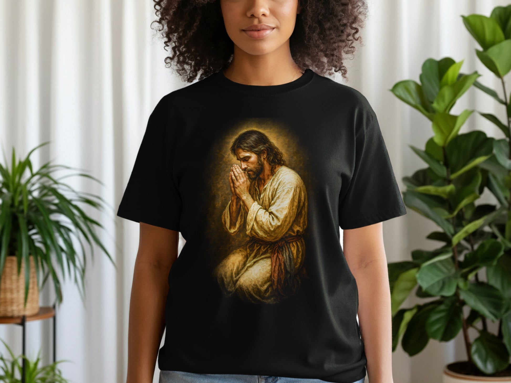 T-shirt with Jesus praying, hands clasped in a gold halo.