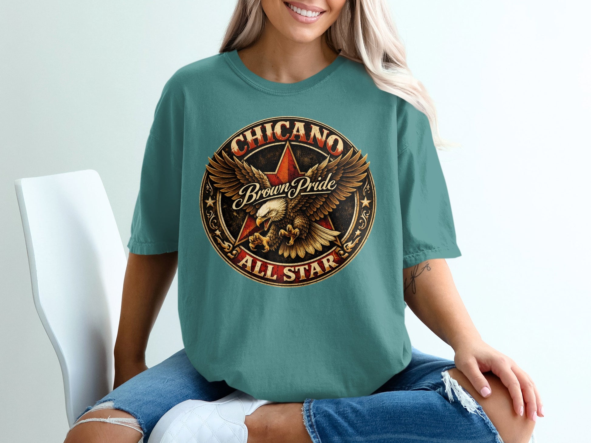Teal t-shirt with "CHICANO Brown Pride ALL STAR" in a circular emblem.