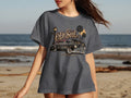 T-shirt with a graphic of a classic lowrider car, palm trees, and 