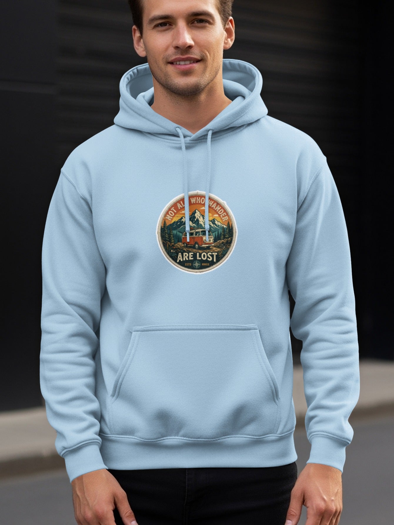 Light blue hoodie with "Not all who wander are lost" circular graphic.