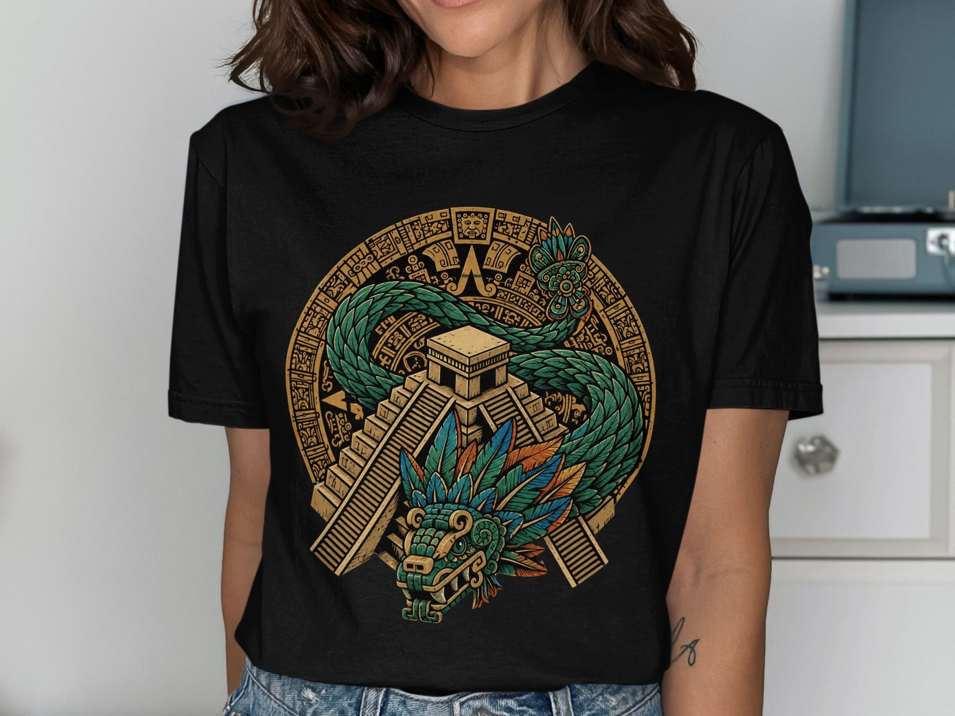 T-shirt with Aztec pyramid and feathered serpent design.