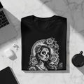 Black t-shirt featuring a Day of the Dead woman adorned with roses and skulls.