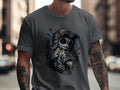 Dark t-shirt featuring a stylized voodoo doll with a baseball cap and tattoos.