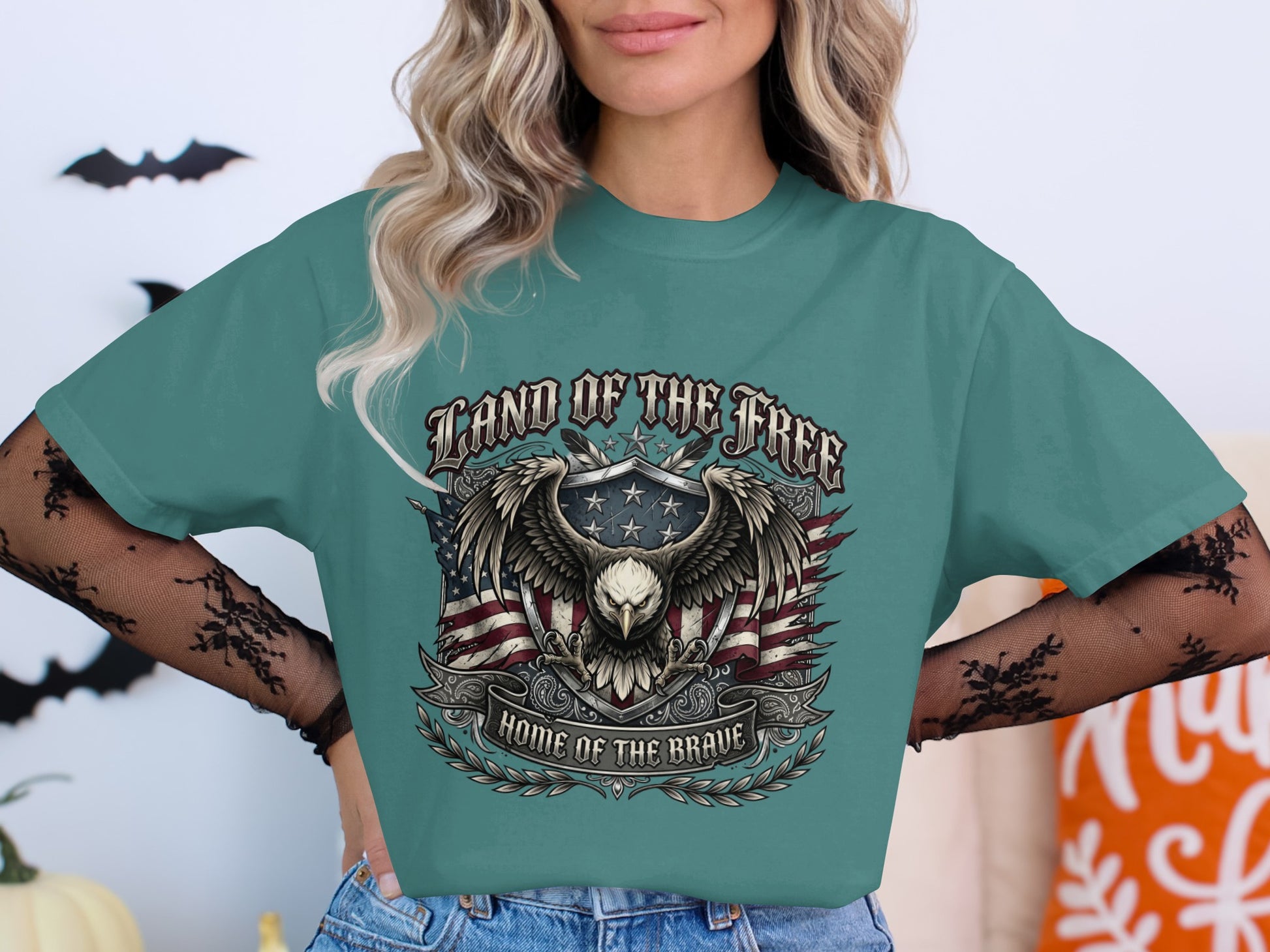 Teal t-shirt with eagle, flag, and "Land of the Free, Home of the Brave" text.