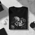 Black t-shirt with Day of the Dead skull couple artwork and roses.