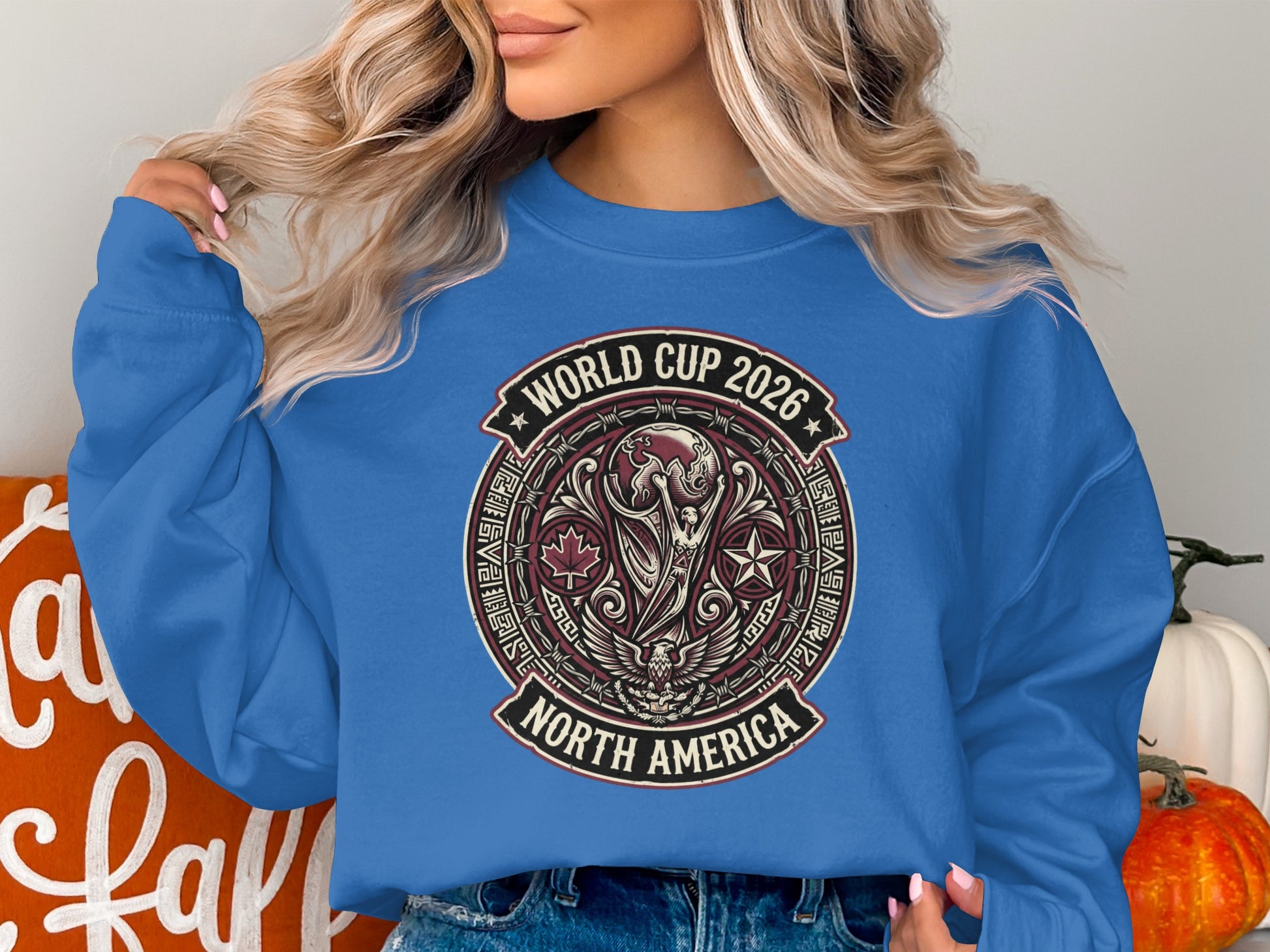 Blue sweatshirt with World Cup 2026 North America logo.