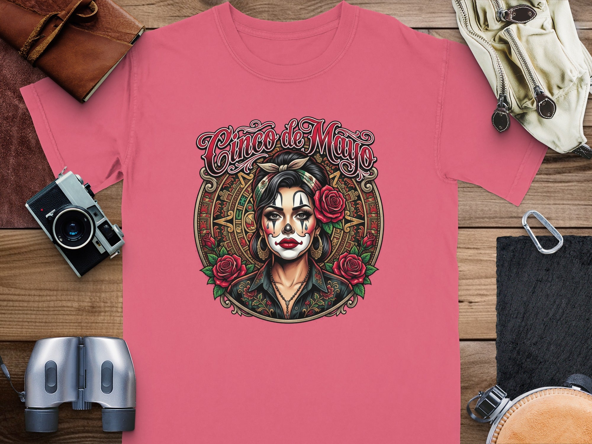 Coral t-shirt with Dia de los Muertos woman illustration and "Cinco de Mayo" text.
