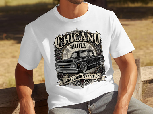 White t-shirt with "CHICANO BUILT" and a black pickup truck graphic.