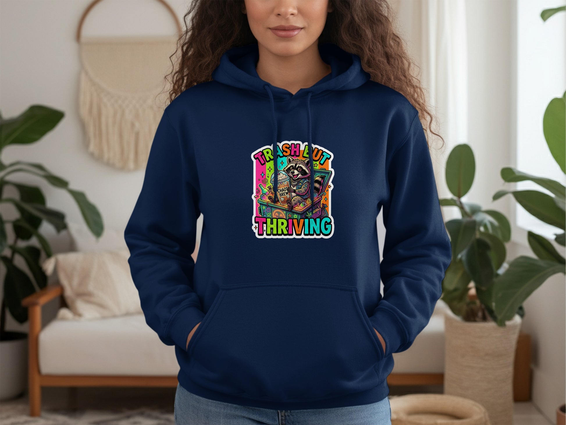 Navy hoodie with "Trash Out Thriving" text and a raccoon character graphic.