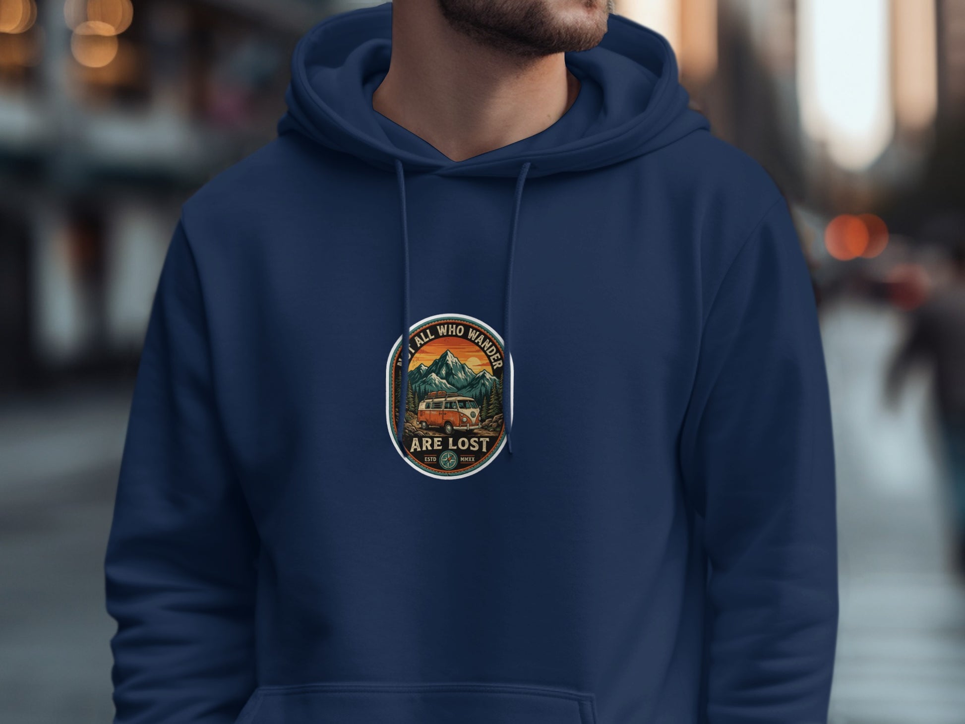 Navy hoodie with circular graphic of camper van, mountains, and forest.