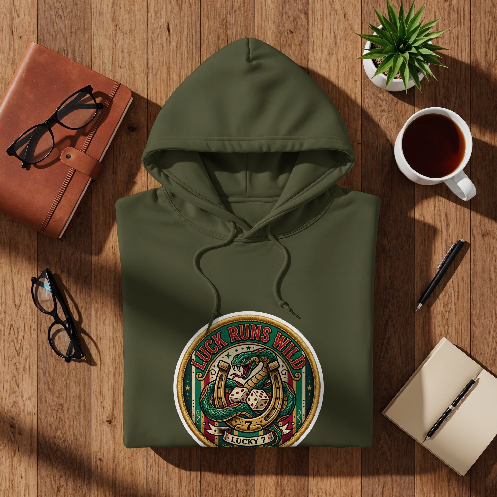 Olive green hoodie with "Luck Runs Wild" and snake, dice, horseshoe graphic.