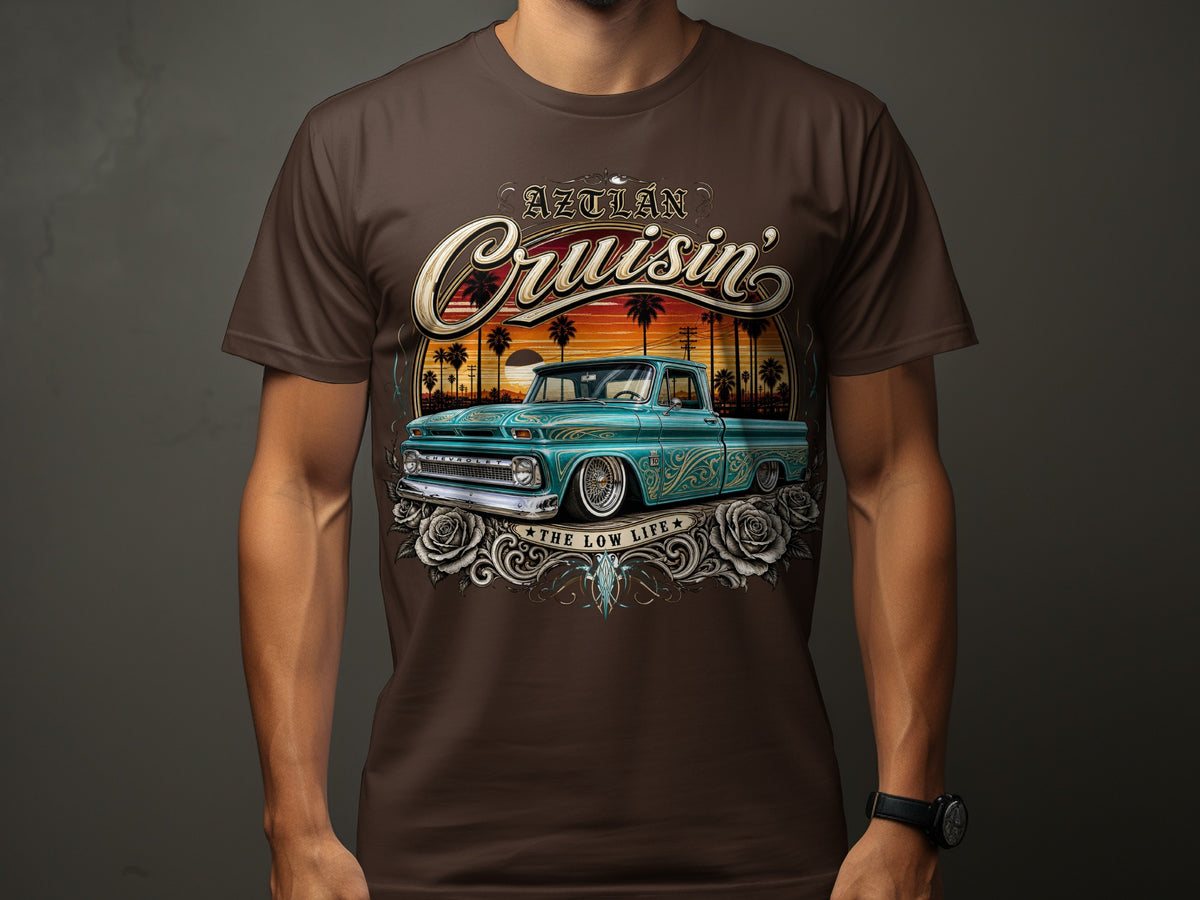 Aztlán Cruisin' graphic on a brown t-shirt featuring a teal classic Chevrolet truck.