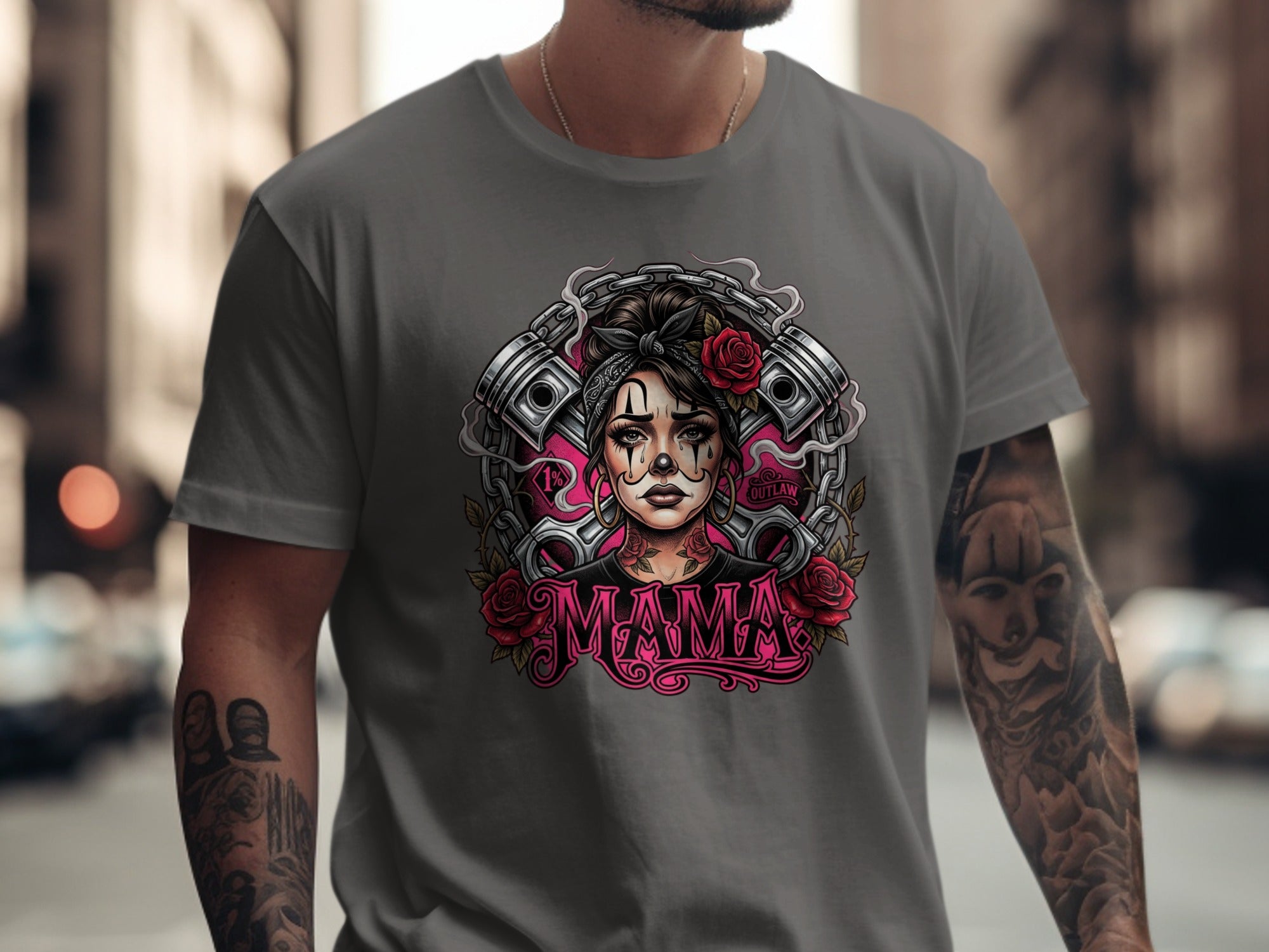 Tattooed woman with pistons and roses graphic on a grey t-shirt.