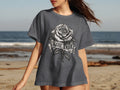 Dark grey t-shirt with a grayscale rose and banner design that says 