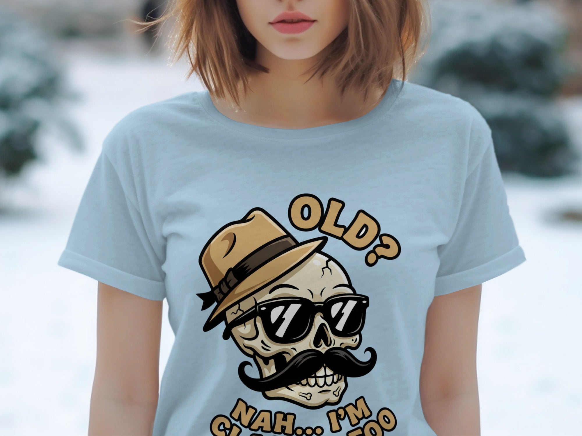 Light blue t-shirt with a skull wearing sunglasses and hat, stating "OLD? NAH... I'M CLASSIC TOO".