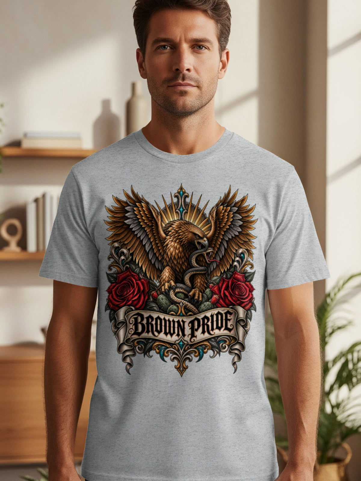 Grey t-shirt with eagle, snake, roses, and banner reading "BROWN PRIDE".