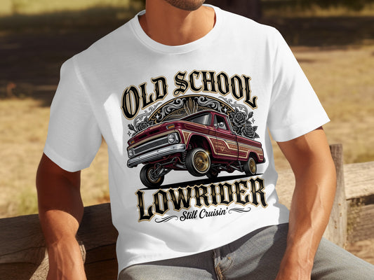 White t-shirt with "Old School Lowrider Still Cruisin'" text and a red lowrider truck graphic.