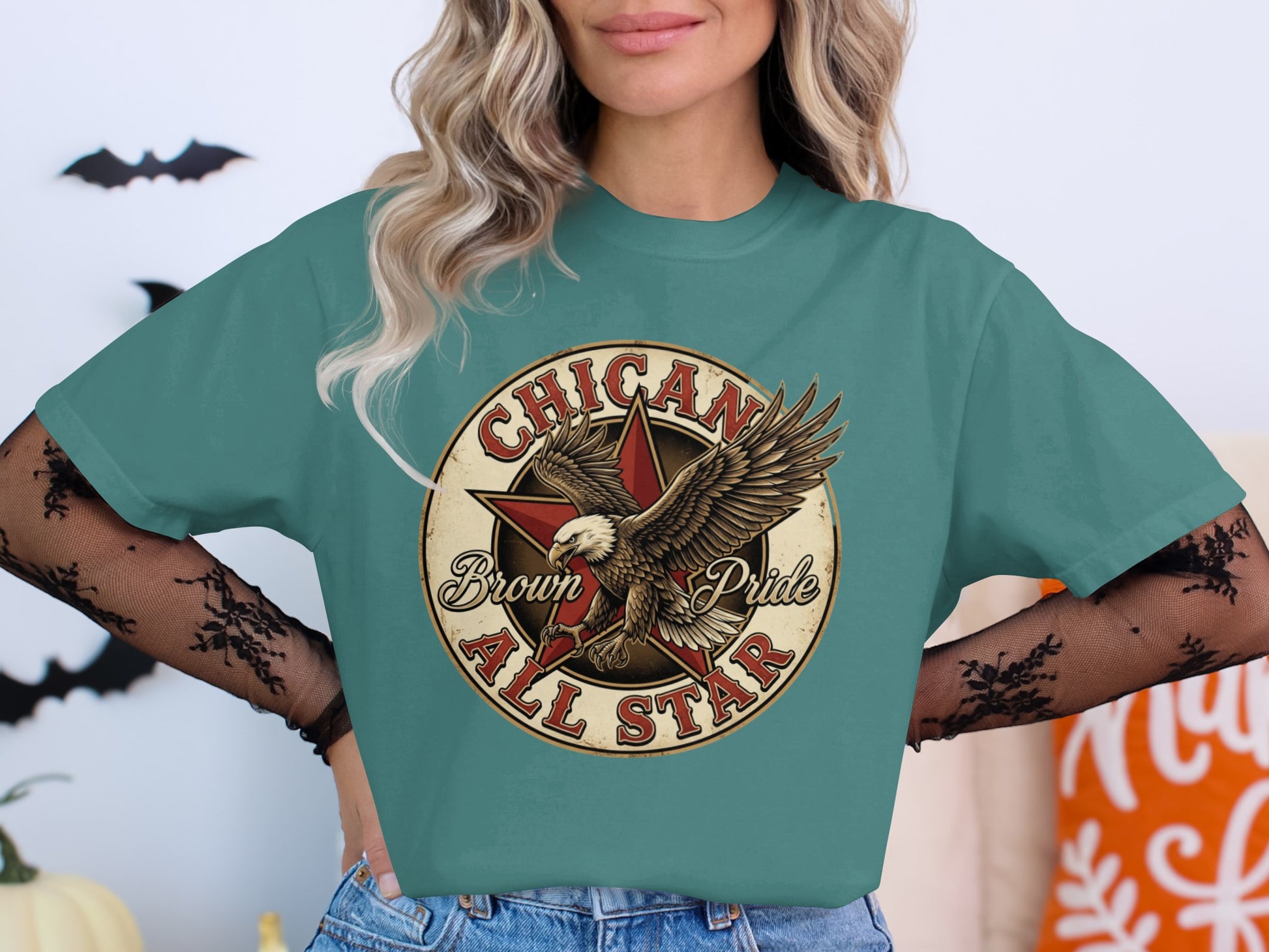 Teal t-shirt with "Chicano Brown All Star" text and a vintage eagle graphic.