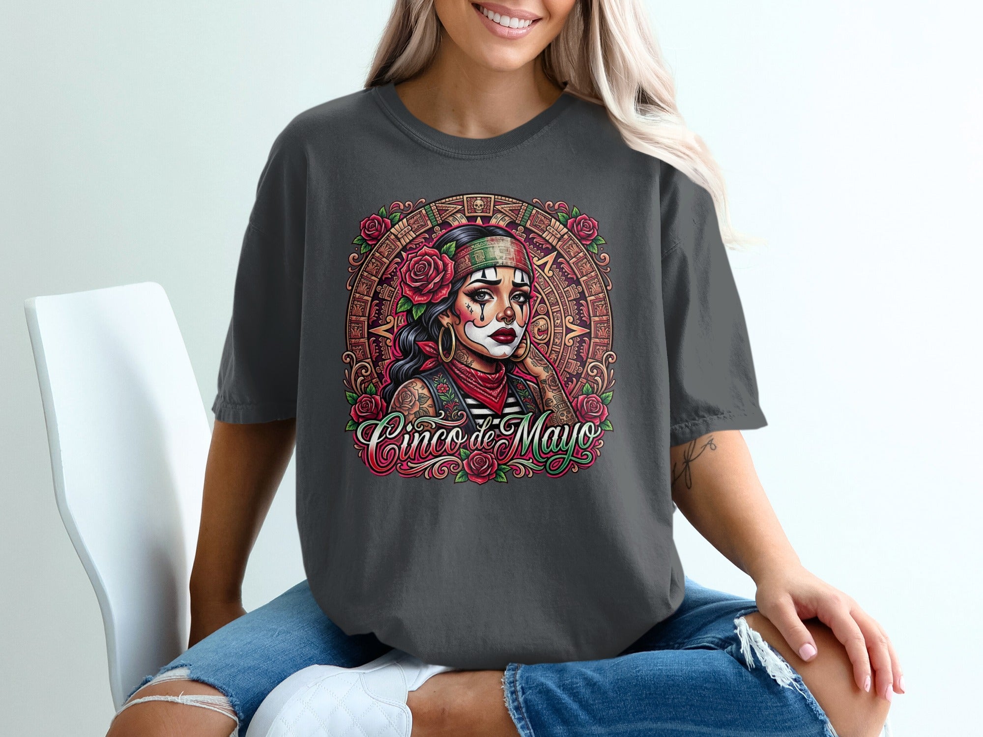 T-shirt with a "Cinco de Mayo" design featuring a woman with face paint and roses.