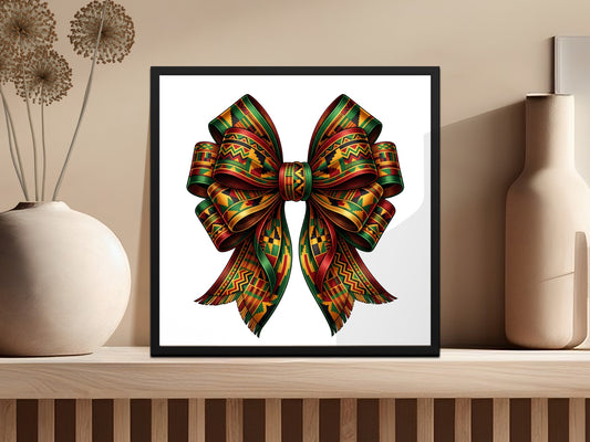 Ornate Kente cloth bow in a black frame on a shelf.