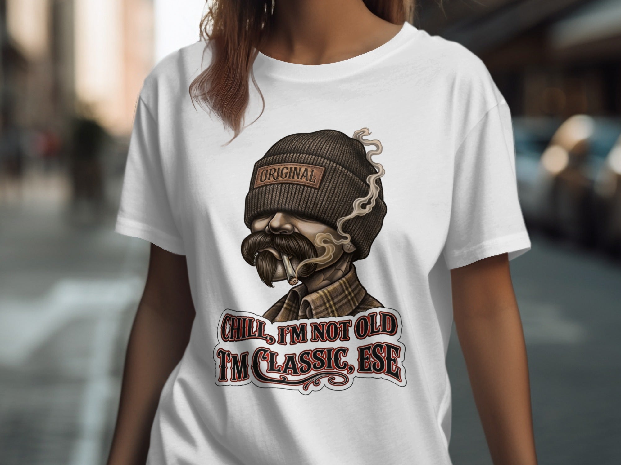 T-shirt with embroidered skull wearing beanie and smoking, text "Chill, I'm not old I'm classic, ese".