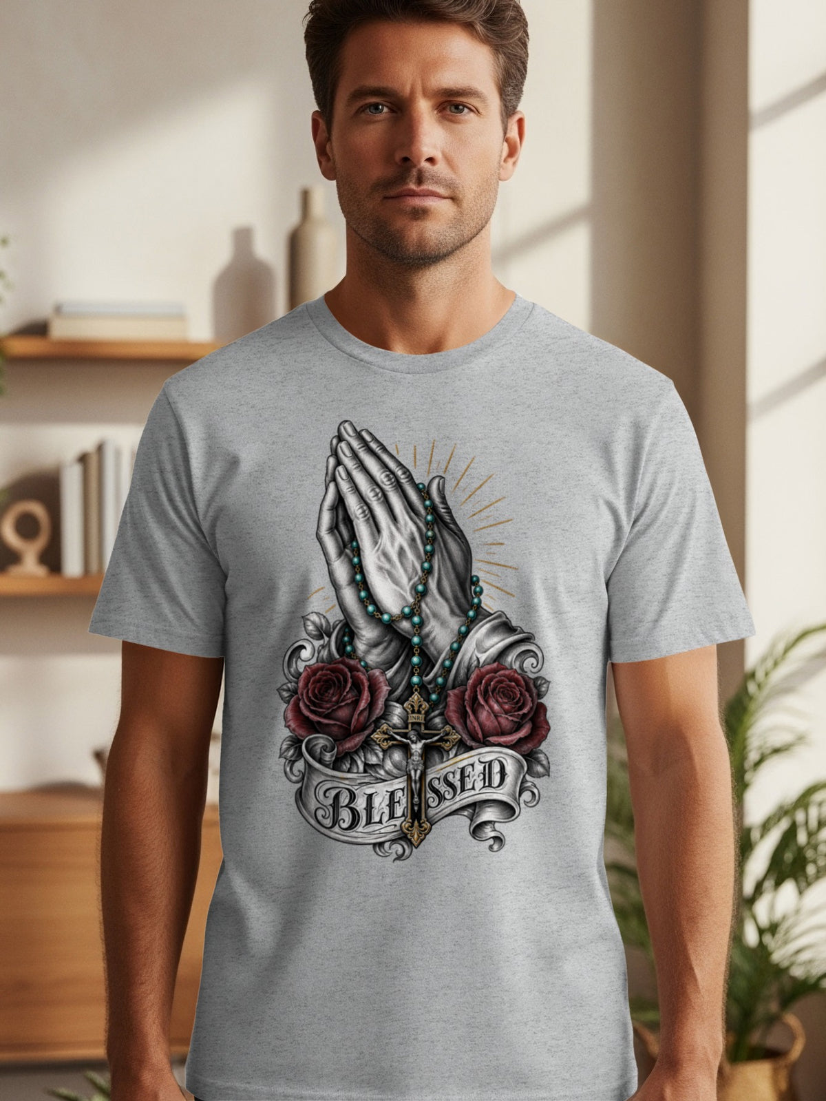 Grey t-shirt with praying hands, rosary, roses, crucifix, and text "BLESSED."